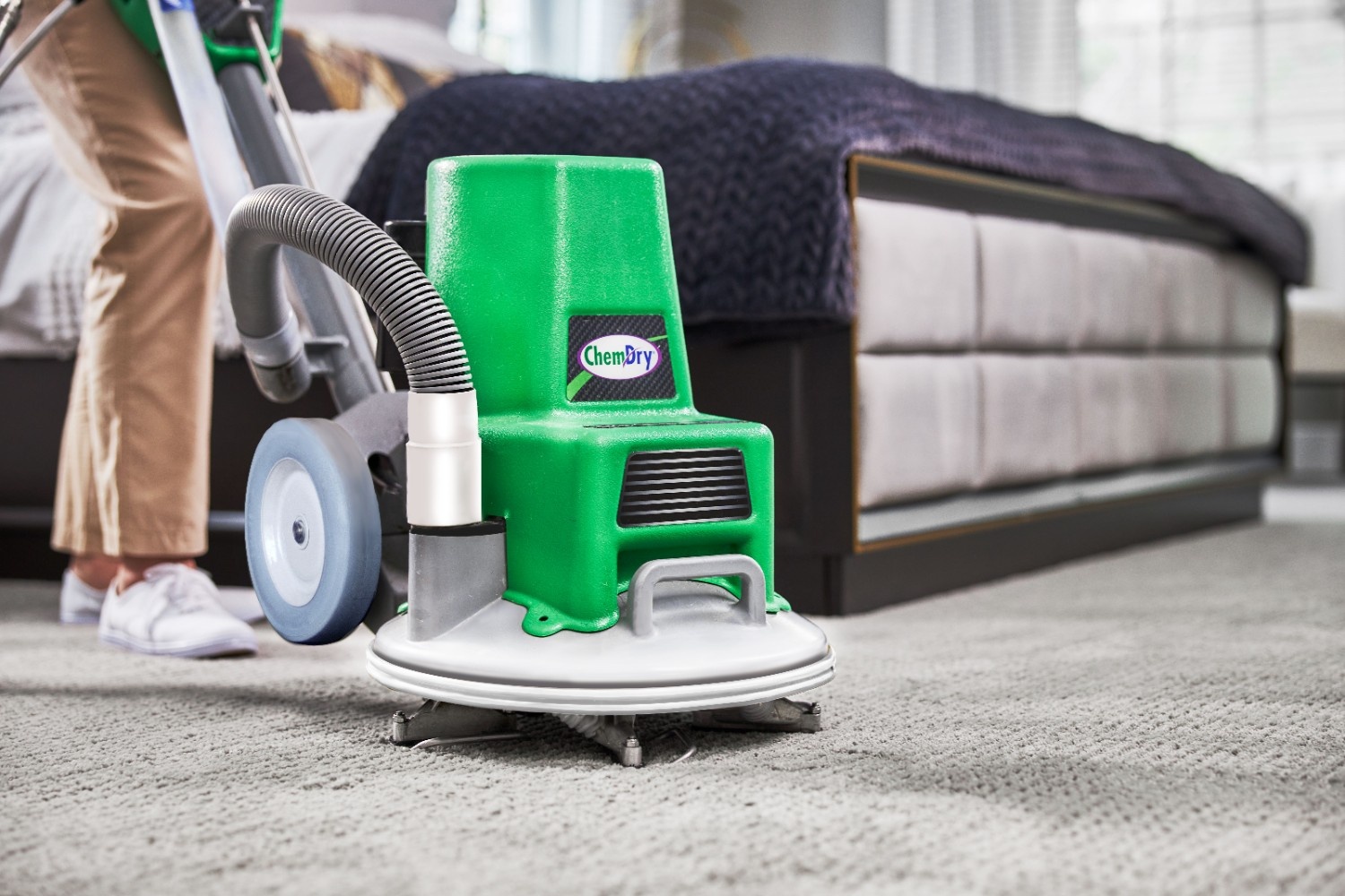 Professional Carpet Cleaning Eco Valley Chem-Dry technician using advanced carpet cleaning equipment for deep professional carpet cleaning in Calgary bedroom.