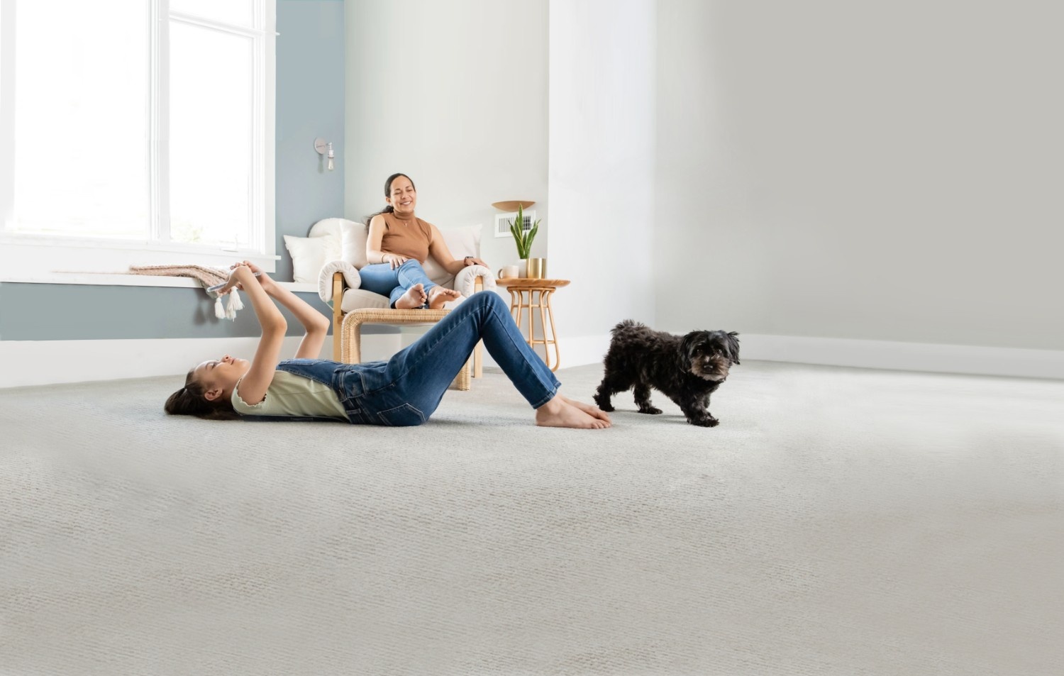 Clean and fresh carpet after professional pet urine odour and stain removal service by Eco Valley Chem-Dry in Calgary, with family and dog enjoying the space.