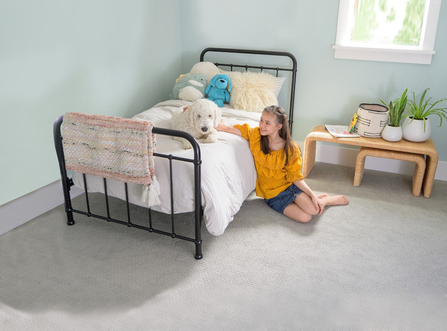 p4 Girl and dog enjoying a clean bedroom carpet after professional carpet cleaning helped kill fleas.