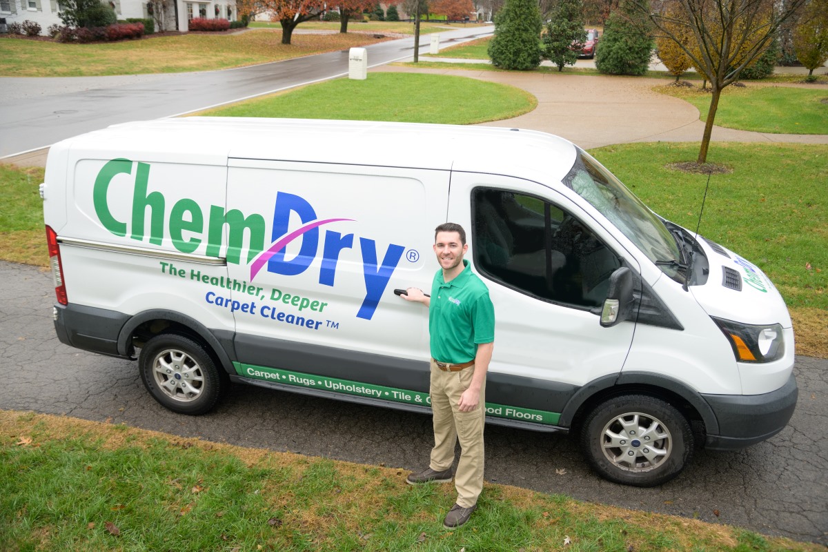 An Eco Valley Chem-Dry technician standing beside the company’s service van, ready to provide professional carpet cleaning and advanced pet urine removal solutions for Calgary homes.