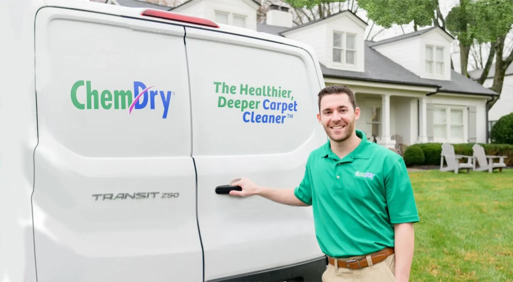 Eco Valley Chem-Dry technician standing beside branded carpet cleaning van in Okotoks