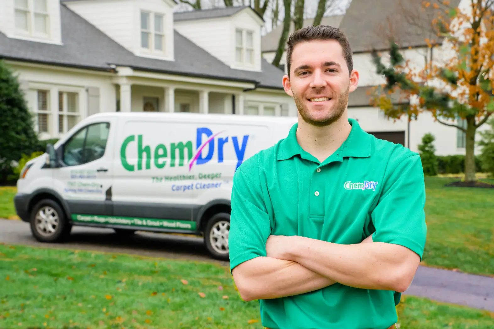 Professional carpet cleaning technician standing outside a residential home with a Chem-Dry service van after completing fast carpet cleaning