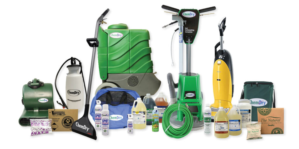 Professional upholstery and carpet cleaning equipment set including extraction machines, hoses, and cleaning solutions