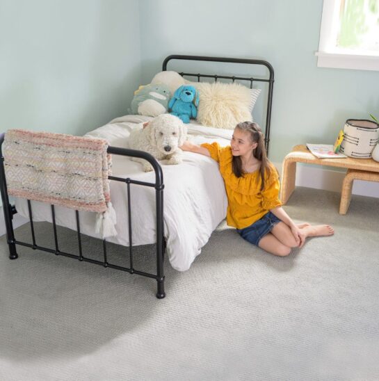 Girl with her dog in a clean, fresh bedroom after professional pet urine odour and stain removal by Eco Valley Chem-Dry in Calgary.