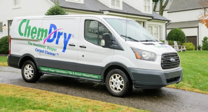Professional carpet cleaning and pet urine removal Eco Valley Chem-Dry service truck parked outside residential home