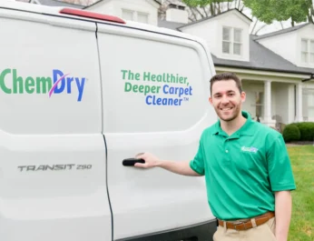 Eco Valley Chem-Dry technician standing beside branded carpet cleaning van in Okotoks