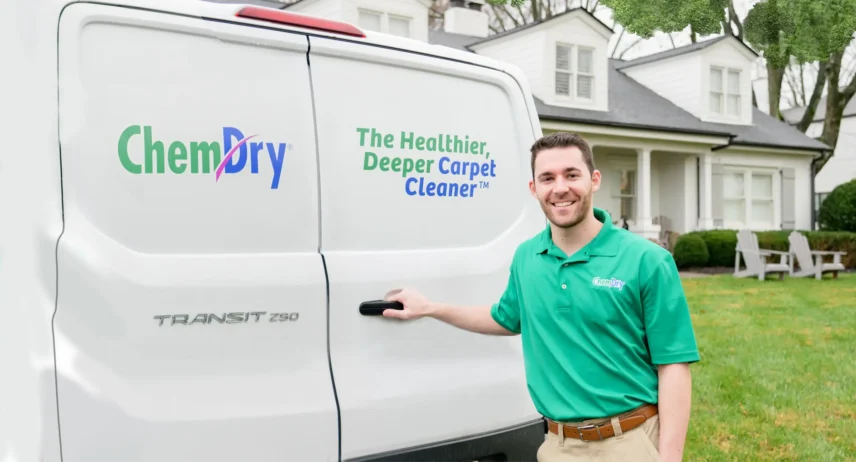 Professional pet urine odour cleaning technician in Calgary standing beside service van for enzyme cleaner treatment for dog and cat urine removal