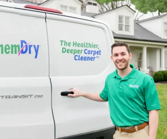 hem-Dry technician beside a service van explaining how long carpet takes to dry after cleaning.