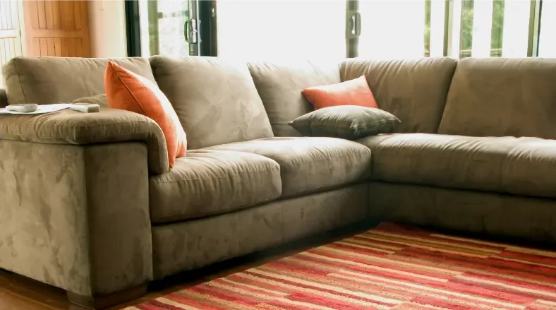 Clean sectional sofa after professional upholstery cleaning service with fresh and restored appearance
