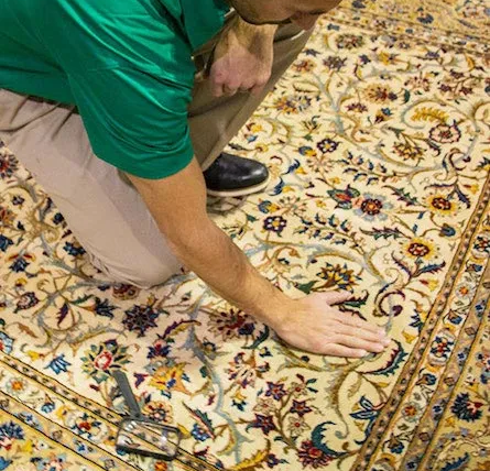 inside_area-and-oriental-rugs-2 Eco Valley Chem-Dry technician inspecting an oriental rug before professional cleaning