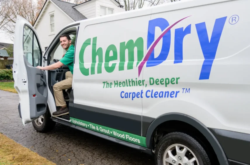 Chem-Dry carpet cleaning technician arriving in a service van for on-the-spot carpet cleaning at a residential home