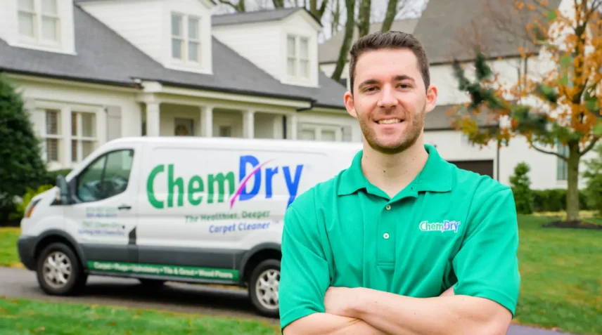 Professional Chem-Dry technician standing beside a service vehicle, representing specialised pet urine odor removal services for Calgary homeowners